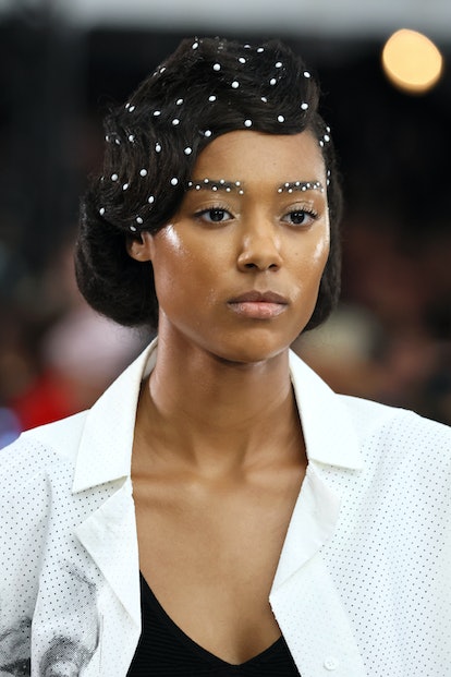 The best NYFW beauty looks include pearl eyebrows as seen on  model walking the runway for Deus Ex M...